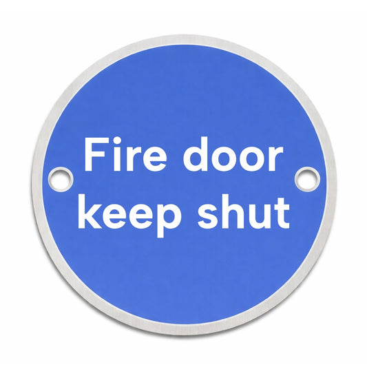 Blue circular rigid metal sign with 'Fire door keep shut' text and fixing holes